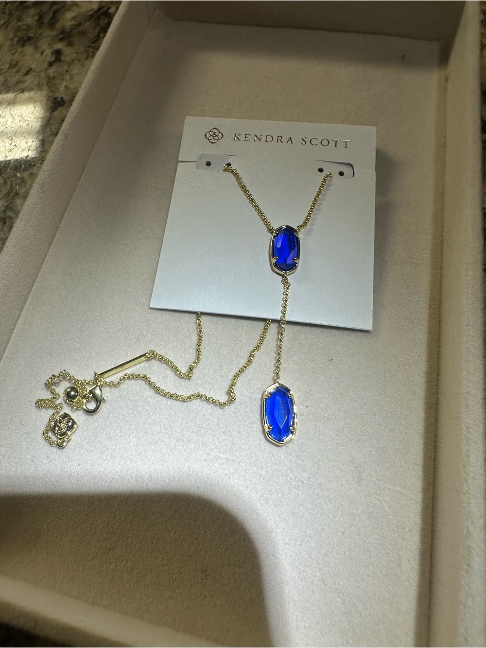 Kendra Scott Gold Lariat Necklace with Royal Blue Stones